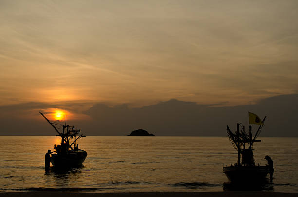 istock fishing boat at dawn in Thailand 177007138