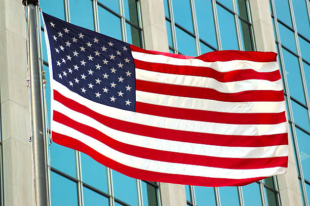 istock American Flag in front of building 177007157