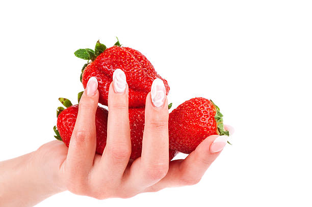 istock Strawberry in the hands isolated on white backgound 177007505