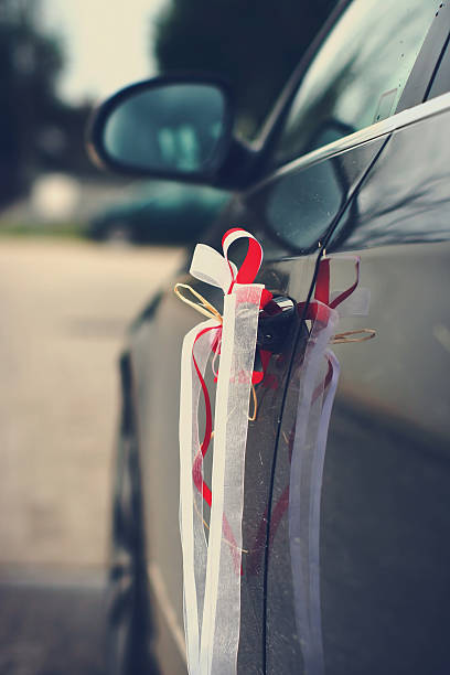 istock Beautiful wedding ribbons on a car 177007971
