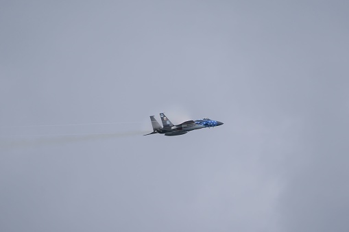 Huntington Beach, United States – October 02, 2023: A jet flying in the sky on a cloudy day