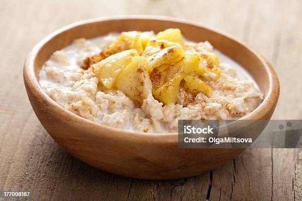 A Picture Of Cereal With Apple Slices In A Bowl Stock Photo - Download Image Now - Apple - Fruit, Oatmeal, Cinnamon