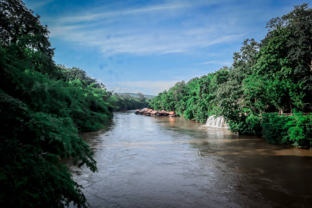 riverside raft and forest in thailand, sai yok yai waterfall, thailand - waterfall woods green river imagens e fotografias de stock