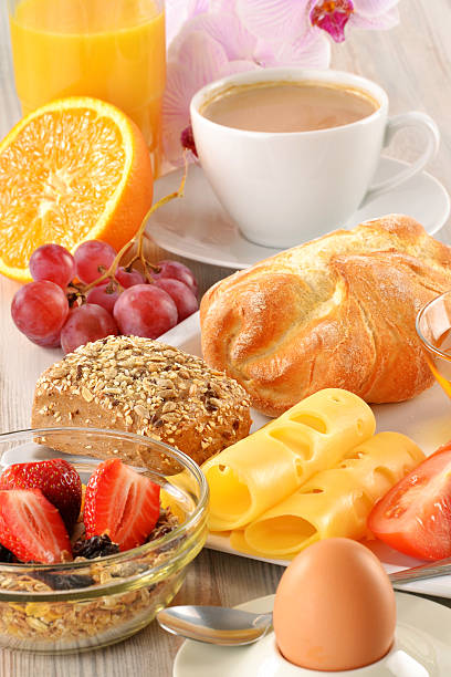 istock Breakfast with coffee, rolls, egg, orange juice, muesli and chee 177008992