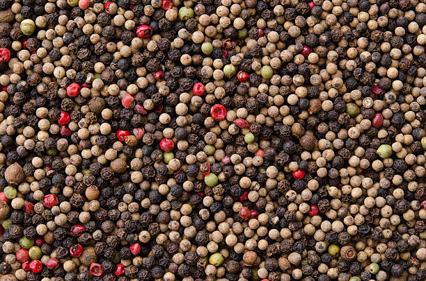 istock Pile of mixed peppercorns forming an even surface. 177009139