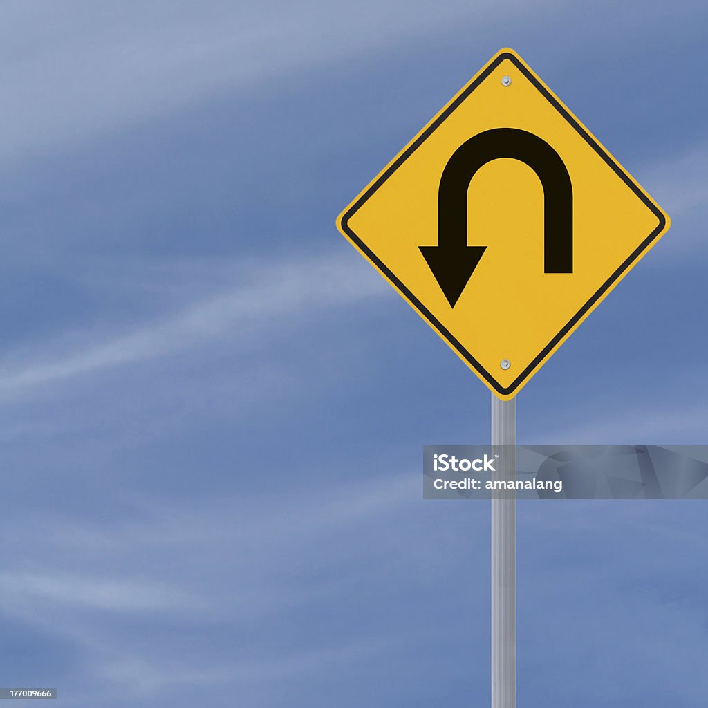 U Turn Ahead Road Sign U-turn road sign on a blue sky background with copy space Blue Stock Photo