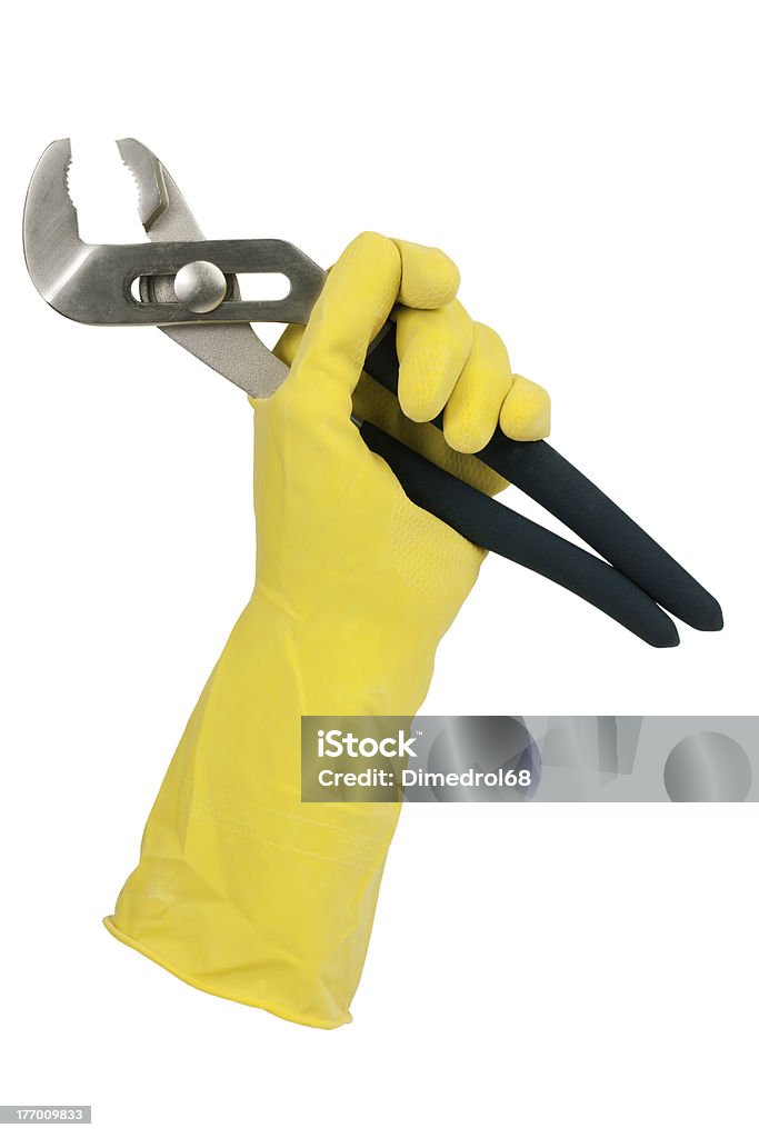 Gloved hand holding clamp Gloved hand holding clamp on a white background Cut Out Stock Photo