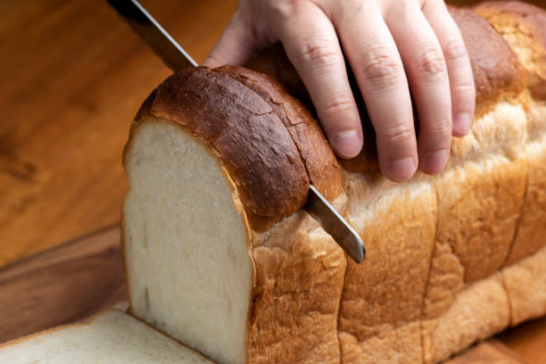 istock Sliced Bread on Wooden Tabletop 1770099474
