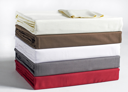 stacked & folded bed sheets
