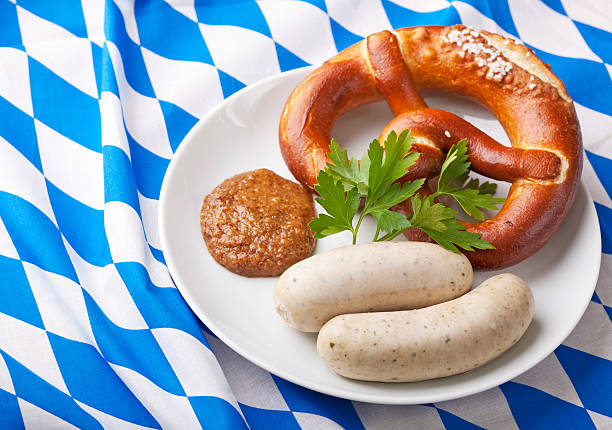 Bavarian white sausages Bavarian white sausages with sweet mustard and bretzels weisswurst photos stock pictures, royalty-free photos & images