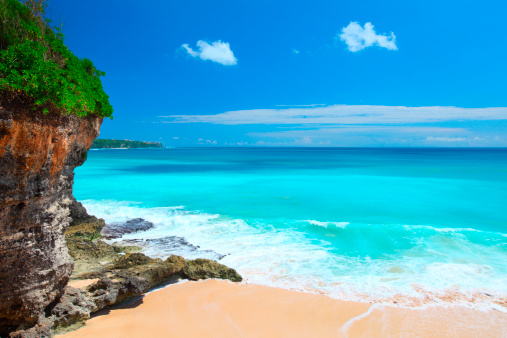 Tropical beach with rock and clear sea