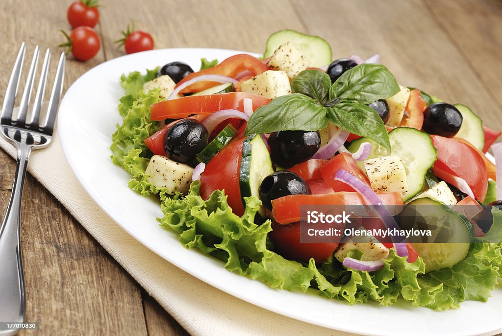 Greek salad Greek salad served on the oak table Antioxidant Stock Photo