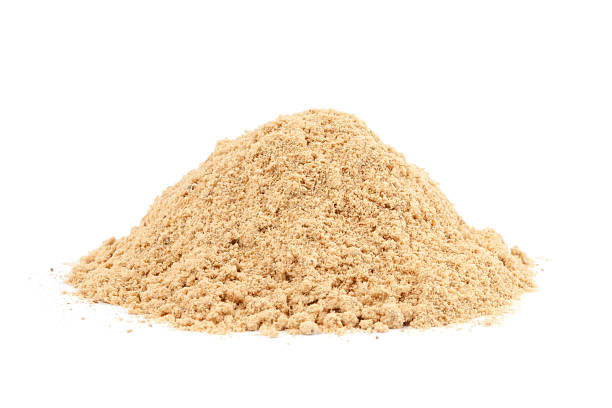 Pile of Ground Ginger (Zingiber officinale) isolated on white ba