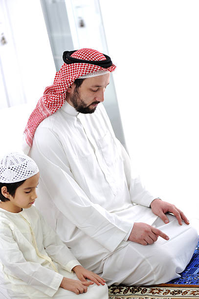 istock Arabic Kid and teacher praying together 177012069