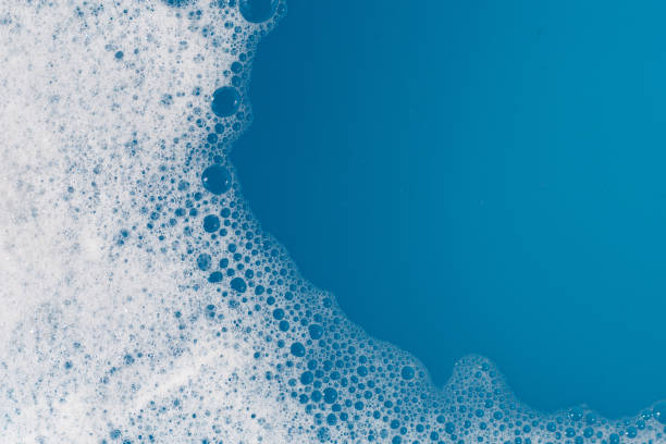 istock Detergent foam bubble on water. Blue background, Soap sud 1770126389