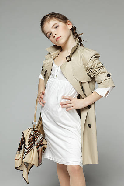 istock Girl posing in trench coat 177012808