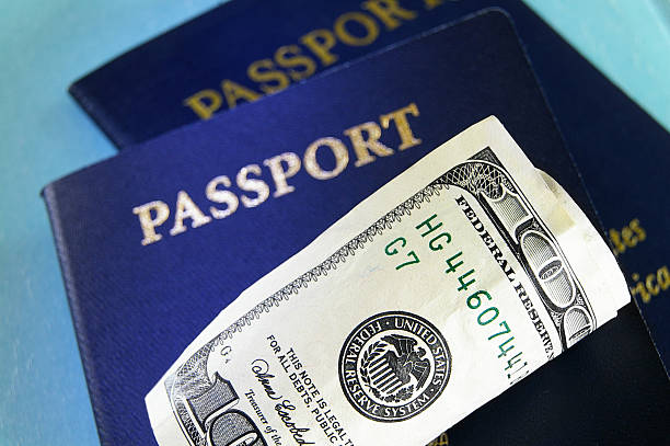 istock cash and U.S. passports 177012918
