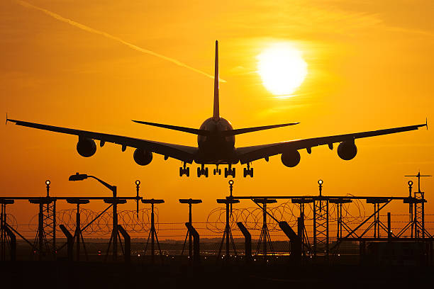 Landing A380 Airbus at sun set heathrow airport stock pictures, royalty-free photos & images