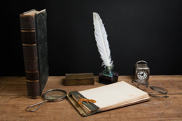 istock Vintage quill and inkwell, notepad, book, magnifying glass, clock, spectacles 177013292