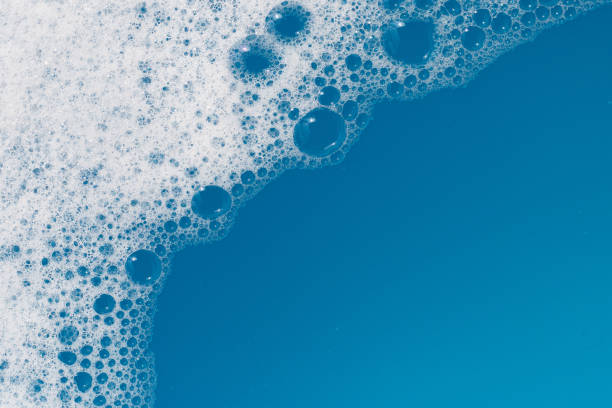 istock Detergent foam bubble on water. Blue background, Soap sud 1770137099