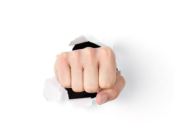 istock Fist coming out the paper hole 177014605
