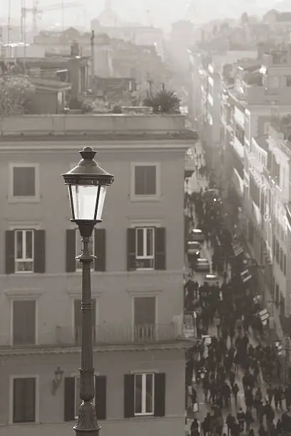 Monochrome shot of the busey crowded streets of Rome from above on the top of the Spanish Steps.