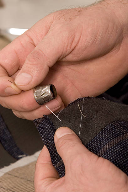 istock detail of sewing hand 177015107
