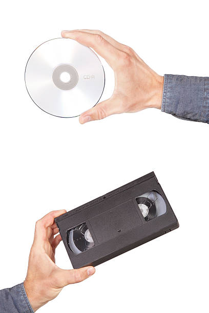 istock Videotape and cd drive in your hand. 177015117