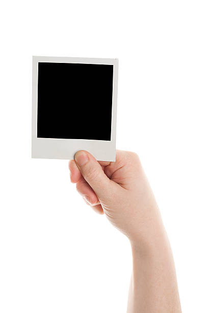 istock One instant photo in hand 177015155
