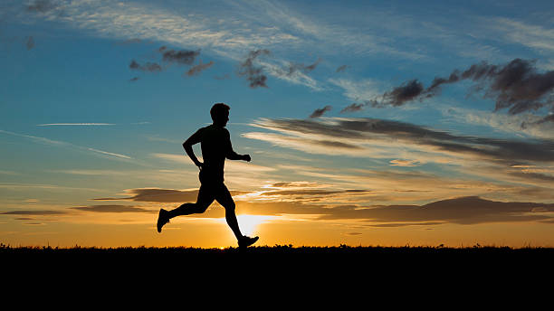 istock A jogger at sunrise as a silhouette 177015534