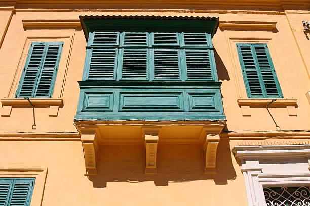 Valletta, Malta - December 19 2022: Malta Historical Old Town and Authentic Houses in Valletta with Green Balconies