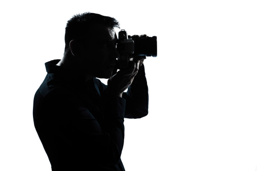 one caucasian man portrait silhouette photographer in studio on white background