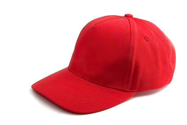 Red Baseball Cap Red Baseball Cap isolated on white sideways baseball hat stock pictures, royalty-free photos & images