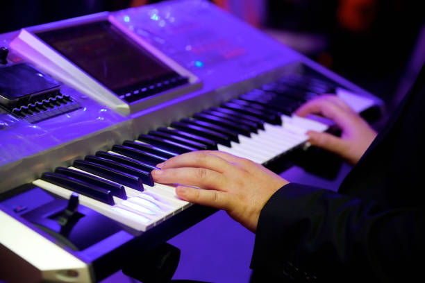 istock The electronic keyboard musical instrument, the synthesizer and the hands playing it. 1770167991