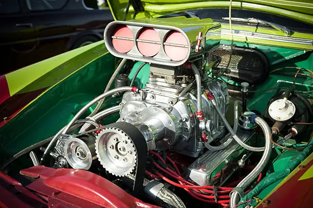 "Powerful supercharge blower inside a colorful hotrod engine bay.For more images, please see my themed lightboxes below."