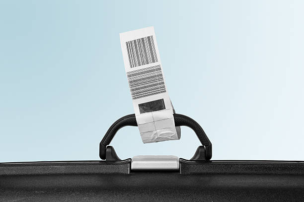 Suitcase attached with airline label stock photo