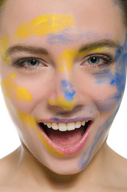 istock smiling woman with paint on his face isolated in white 177017728