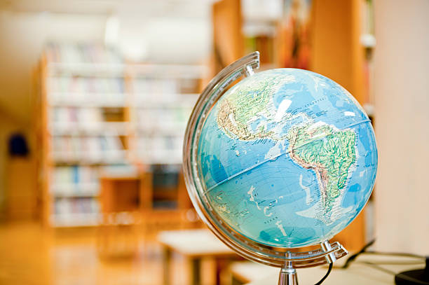 istock Traditional globe in an out of focus library setting 177017732