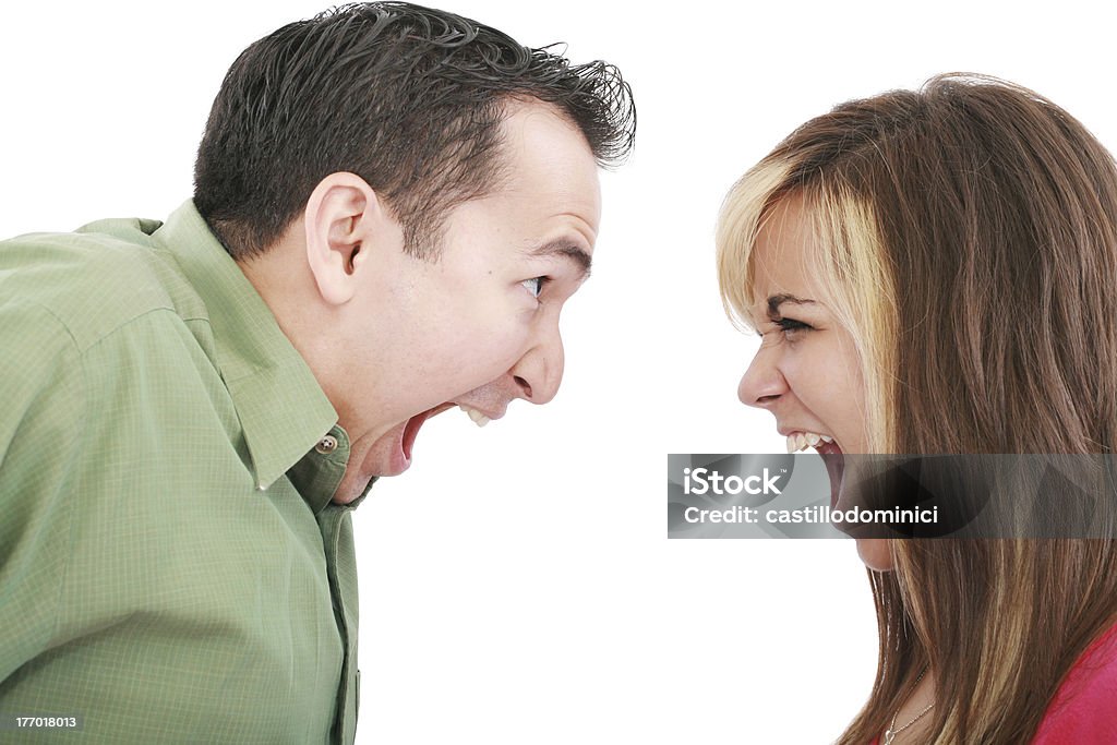 Portrait of a man and woman yelling at each other Portrait of a man and woman yelling at each other against white background Adult Stock Photo