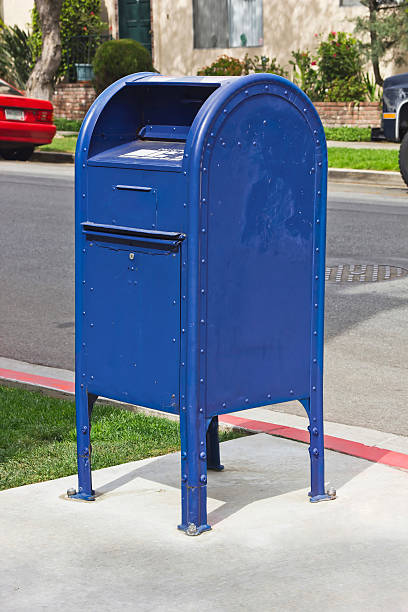 Mail Box Drop Container Drop box for mail in a residential neighborhood. blue mailbox stock pictures, royalty-free photos & images