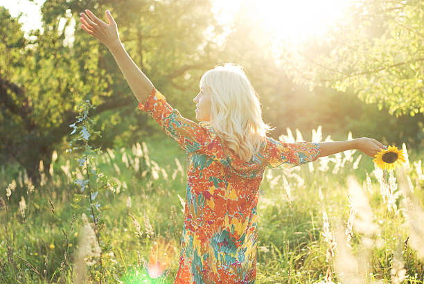 istock girl with sunflower 177018629