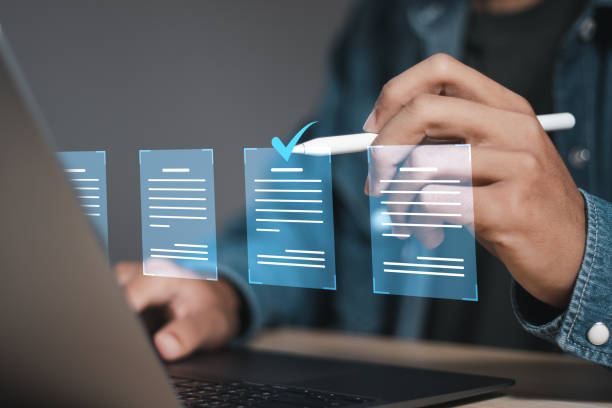 istock Document management concept, businessman using laptop with online quality assurance approval document. Verifying electronic documents on digital documents, paperless document management system. 1770188914