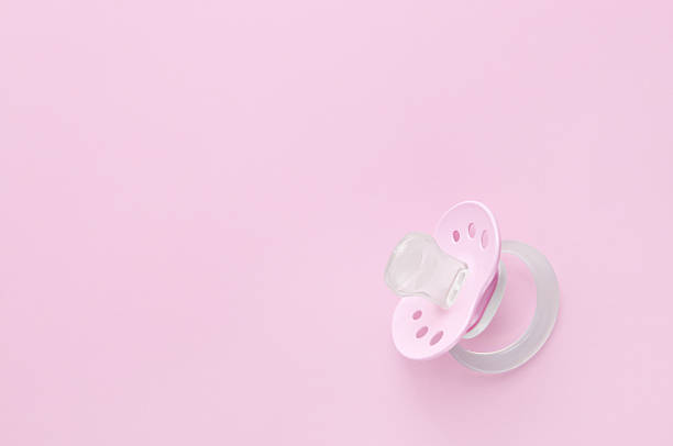 Baby soother in pink stock photo
