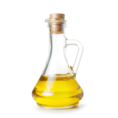 carafe of olive oil on white background. Isolated path included.