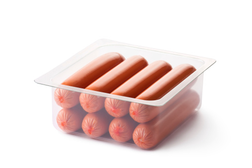 Opened pack of sausages. Isolated on a white.