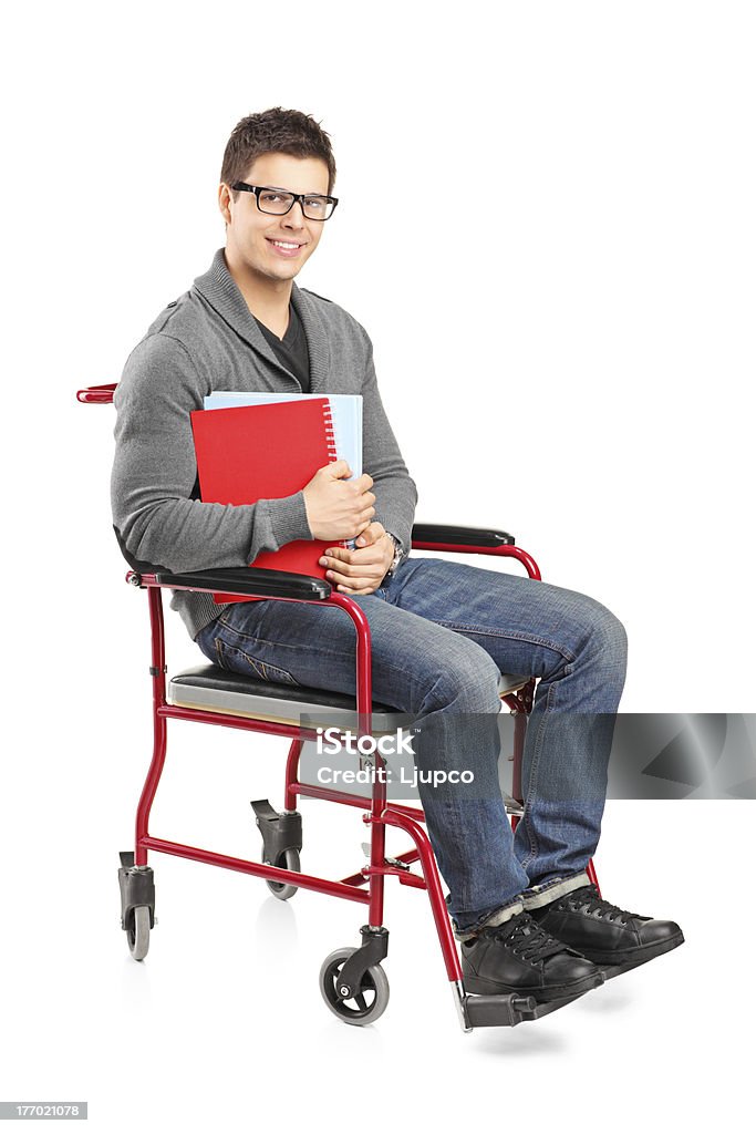 Sorridente homem em uma cadeira de rodas a segurar portáteis - Royalty-free Cadeira de Rodas Foto de stock