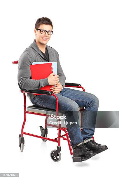 Sorridente Homem Em Uma Cadeira De Rodas A Segurar Portáteis - Fotografias de stock e mais imagens de Cadeira de Rodas