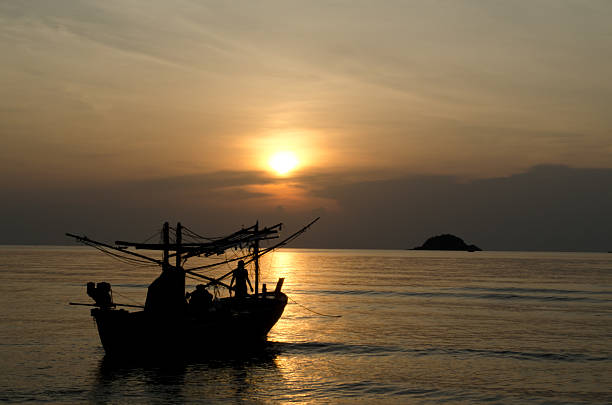 istock fishing boat at dawn in Thailand 177021131
