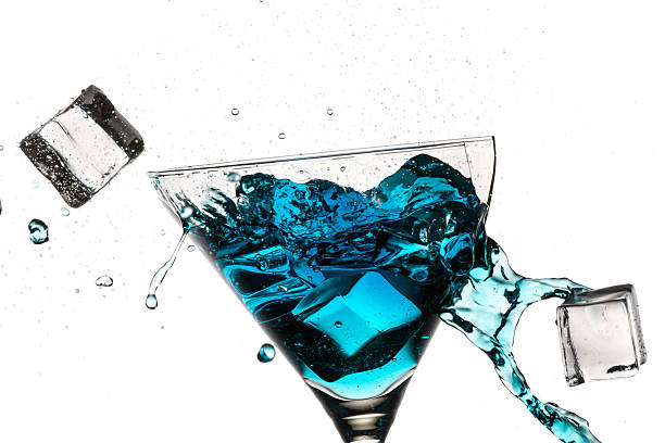 istock Ice cubes breaking martini glass filled with blue liqueur 177021613