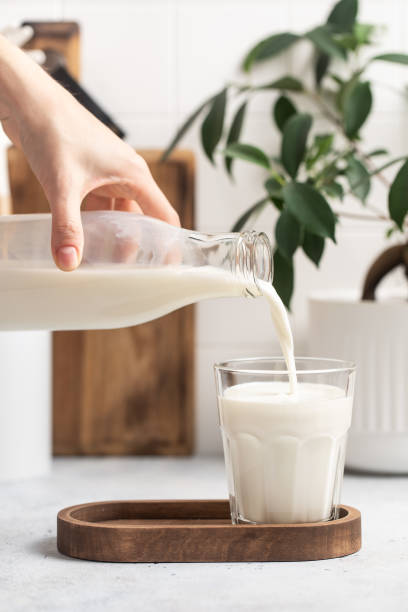 istock Milk is poured from a bottle into a glass 1770217171